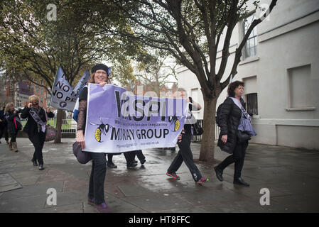 London, UK. 08th Mar, 2017. International Women's Day demonstration at Westminster, with WASPI (Women Against State Pension Inequity) from all over the Kingdom. Boys from Make Her Smile gave free red roses to women at Parliament Square. To substain the russian feminism, they blown a baloon to celebrate the day. Credit: Alberto Pezzali/Pacific Press/Alamy Live News Stock Photo