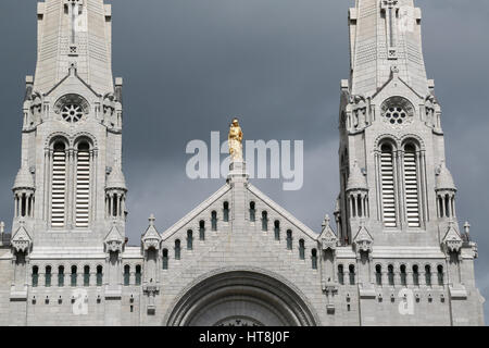 Statue of Saint Anne with grandson Jesus in her arms atop the Basilica of Sainte-Anne-de-Beaupré Stock Photo