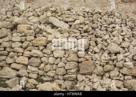 pile of bricks made from white limestone for renovation of medieval castle Stock Photo