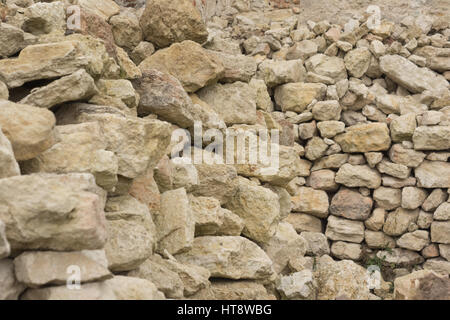 pile of bricks made from white limestone for renovation of medieval castle Stock Photo