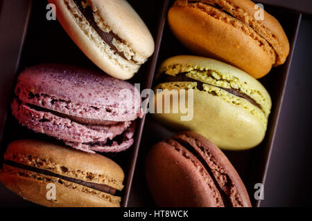 Macaroons In Box On Table Stock Photo