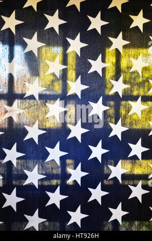 View of translucent American flag on a back porch with window in background Stock Photo