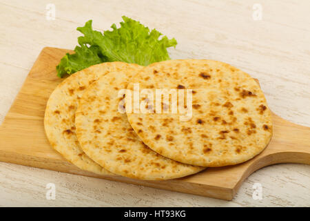 Pita bread with salad over wood background Stock Photo