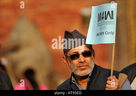 Kathmandu, Nepal. 08th Mar, 2017. A Nepalese man old banner on a prade with the slogan 'Men March for Woman' during 107th International Women's Day Celebrates in Patan, Nepal on Wednesday, March 08, 2017. Credit: Narayan Maharjan/Pacific Press/Alamy Live News Stock Photo