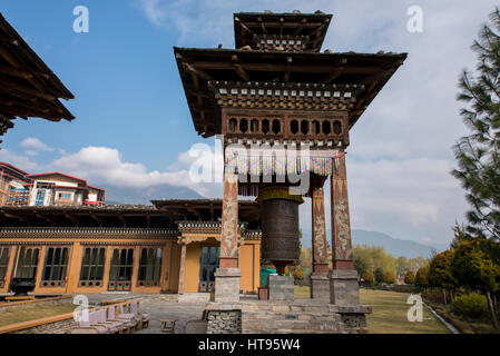 Bhutan, Thimphu, capital of Bhutan. Five-star luxury hotel, Taj Tashi Hotel, located in downtown Thimphu. Back courtyard prayer wheel. Stock Photo