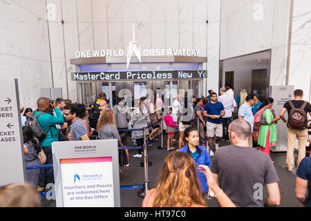 Inside look at the main entrance to the One World Observatory with view on people standing in lines to get tickets at the booth Stock Photo