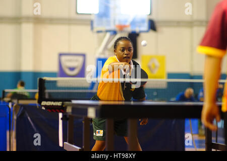 Trisome Games July 2016. US Affrico indoor gym. Florence, Italy.  Young female down syndrome athlete playing table tennis ping pong Stock Photo