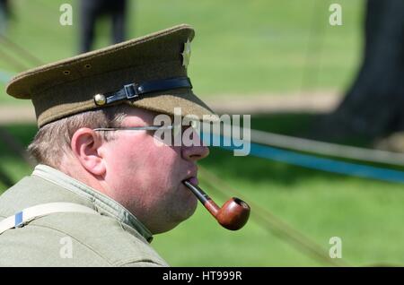 CRESSING TEMPLE ENGLAND 17 May 2015: Man in reenactment uniform smoking  a pipe Stock Photo