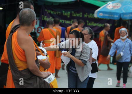 Sorn-Wan Sirishuntarintr (Aka. Pa-Cheng) reported herself according to the NCPO summons order no. 5/2560 (2017) on March 5, 2017 at Frontier Police offices section 1 on term disobey an order of NCPO. She was accused because she allow monks and Buddhists who those support Dhammakaya Temple (Wat Phra Dhammakaya) to convene in her own land which is not so far from the Wat Phra Dhammakaya.   Additional images to showing the recently situation around Wat Phra Dhammakay after restricted and enclosed the area by NCPO’s and DSI’s order. (Photo by Thitinun Sampiphat / Pacific Press) Stock Photo