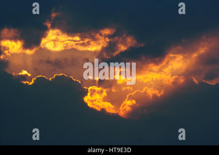 Fiery break in the dark clouds Stock Photo