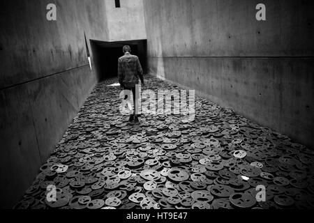 Berlin. Germany. Jewish Museum. Shalekhet (Fallen Leaves) art installation in the Memory Void, by Israeli artist Menashe Kadishman consists of over 10 Stock Photo