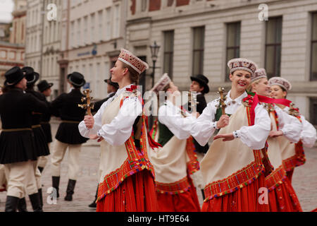 Dancers in national costumes performs on the Dome square in Riga, Latvia Stock Photo