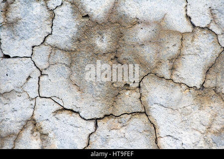 Wet dramatic concrete cracked background wall Stock Photo