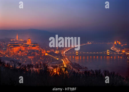 Night falling in Budapest, Hungary. View from Gellert Hill and Citadella castle, on the side of Buda. Stock Photo