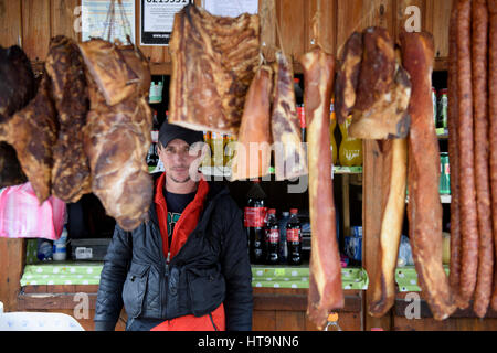 Road market stall selling smoked meat and sausages in Transfagarasan Highway, Romania. Stock Photo