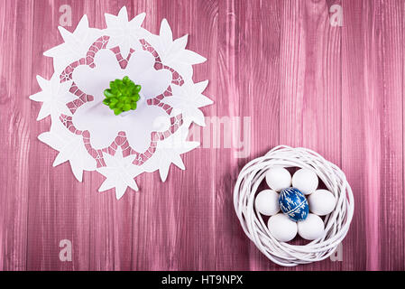 Flat lay view of painted and white easter eggs. Stock Photo
