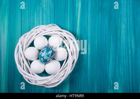 Flat lay view of painted and white easter eggs. Stock Photo