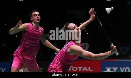 England's Chris Adcock (left) and Gabrielle Adcock in action during their Mixed doubles match during day three of the YONEX All England Open Badminton Championships at the Barclaycard Arena, Birmingham. Stock Photo