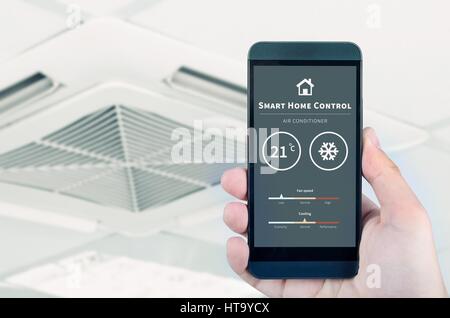 Air conditioner remote control with smart home system on digital device. Stock Photo
