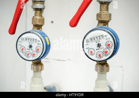 Sanitary equipment. Pair of meters of the water close up Stock Photo