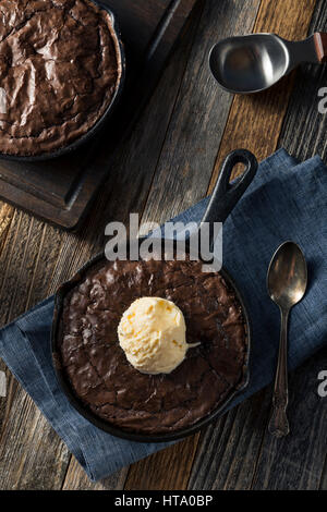 Homemade Sweet Dark Chocolate Brownie in a Skillet Ready to Eat Stock Photo