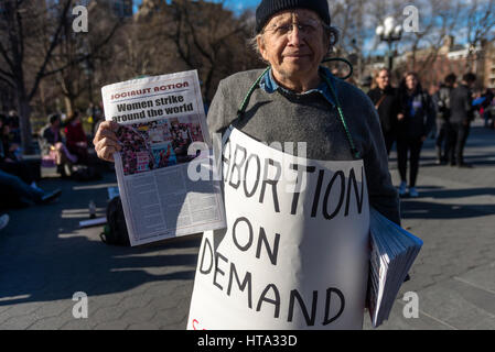 New York, USA. 8th Mar, 2017. Women marked International Women's Day - A Day Without a Woman, with a rally in Washington Square Park followed by a march. Many women wore red and took the day off as a general strike. Credit: Stacy Walsh Rosenstock/Alamy Live News Stock Photo