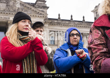 Berlin, Germany. 9th Mar, 2017. Under the motto ''We are hands bound'' more than 100 humanitarian aid workers meet in front of the German Reichstag-Building to demand humanitarian access and the protection of international law. In the run-up to the sixth year of the Syrian crisis, more than 20 German relief organizations are pointing out that Syria is still home to about 5 million people in 13 besieged and difficult-to-reach areas. Credit: Jan Scheunert/ZUMA Wire/Alamy Live News Stock Photo