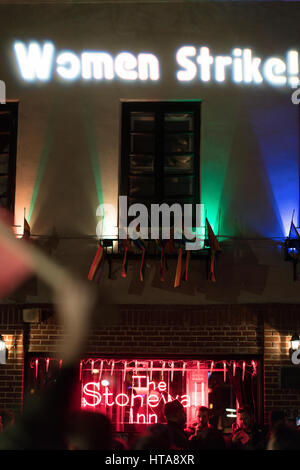 New York City, USA. 8th March 2017.  “Women Strike!” being projected onto The Stonewall Inn during the International Working Women’s Day Strike march in NYC. Credit: Sinisa Kukic/Alamy Live News  Stock Photo