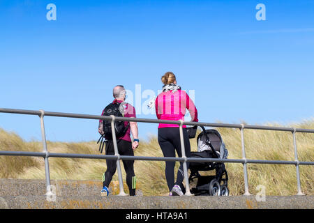 Crosby, Liverpool, Merseyside. 9th Mar, 2017. UK Weather.  With glorious spring sunshine raining down on the north west of England, dog walkers and joggers take to the seaside at Crosby Coastal Park in Merseyside.  Credit: Cernan Elias/Alamy Live News Stock Photo
