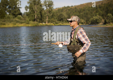 Idaho, USA. 7th Aug, 2016. Courtney Conklin and Jed Conklin flyfish for trout on the North Fork of the Coeur d'Alene River in North Idaho on a summer evening. Credit: Credit: /ZUMA Wire/Alamy Live News Stock Photo