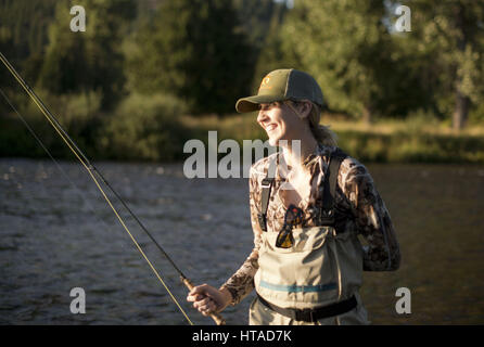 Idaho, USA. 7th Aug, 2016. Courtney Conklin and Jed Conklin flyfish for trout on the North Fork of the Coeur d'Alene River in North Idaho on a summer evening. Credit: Credit: /ZUMA Wire/Alamy Live News Stock Photo