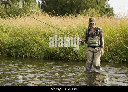 Idaho, USA. 7th Aug, 2016. Courtney Conklin and Jed Conklin flyfish for trout on the North Fork of the Coeur d'Alene River in North Idaho on a summer evening. Credit: Credit: /ZUMA Wire/Alamy Live News Stock Photo