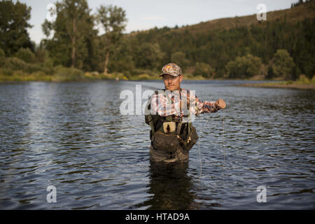 Idaho, USA. 7th Aug, 2016. Courtney Conklin and Jed Conklin flyfish for trout on the North Fork of the Coeur d'Alene River in North Idaho on a summer evening. Credit: Credit: /ZUMA Wire/Alamy Live News Stock Photo