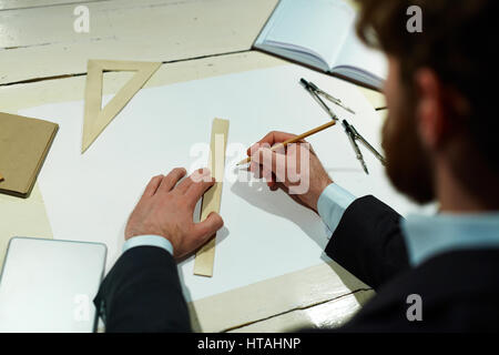 Architect with pencil and tools drawing sketch on blank paper Stock Photo