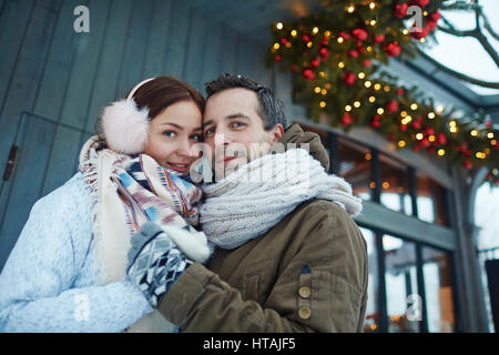 Romantic dates in winterwear enjoying winter day Stock Photo