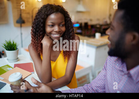 Young professionals discussing their ideas at meeting Stock Photo