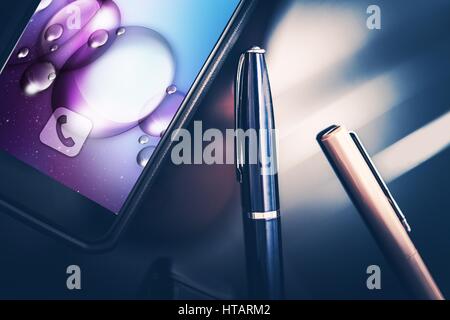 Smartphone in Business. Modern Desk Equipment and Tools. Smartphone and Elegant Pens on the Glassy CEO Desk. Closeup Photo. Stock Photo