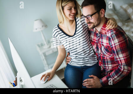 Couple in love shopping and buying goods from internet Stock Photo
