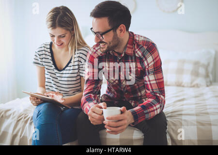 Leisurly couple in love shopping online using tablet Stock Photo