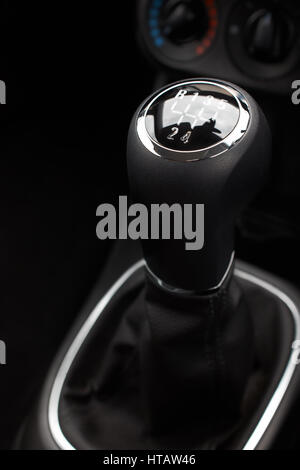 A closeup of a black and silver car gear stick Stock Photo