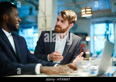 Businessmen discussing project or data Stock Photo