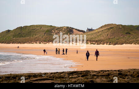 Families walking along a beach. Embleton Bay, North East of England.UK. Stock Photo