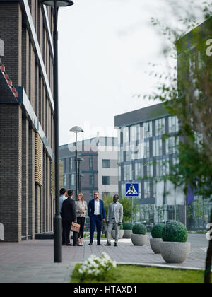 Team of managers having meeting outdoors Stock Photo