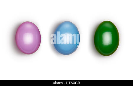 Looking down, vertical vew of large colorful decorated Easter eggs isolated on a white background. Stock Photo