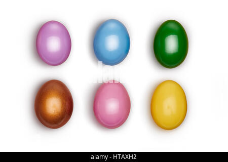 Looking down, vertical vew of Small colorful decorated Easter eggs isolated on a white background. Stock Photo