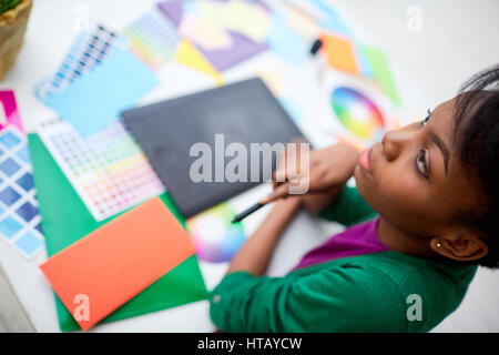 Serious girl concentrated on work Stock Photo