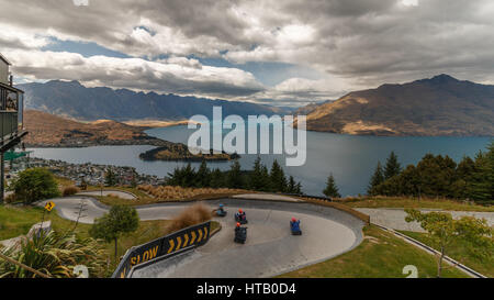 Luge Riders Panorama View of Queenstown and Remarkables mountains from Gondola, New Zealand