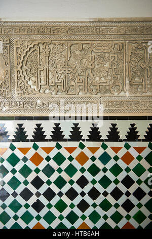 Arabesque Zellighe tiles with Mudjar plasterwork from tyhe vestibule of the Alcazar of Seville, Seville, Spain Stock Photo