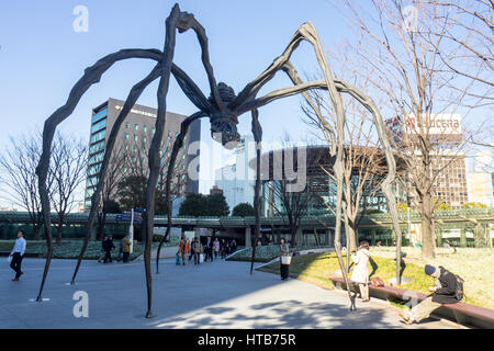 Maman, a bronze  and marble sculpture of a spider by the artist Louise Bourgeois, at the base of Mori Tower, Roppongi Hills, Tokyo. Stock Photo