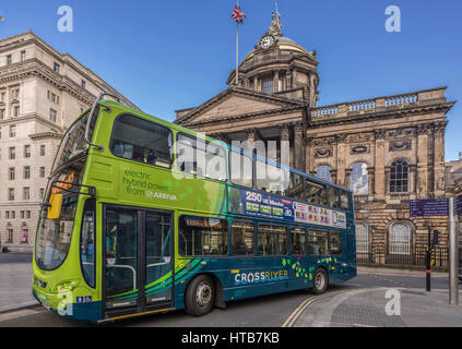 Arriva Crossriver Hybrid double decker bus infront of the Liverpool Town Hall turning into Castle Street. Stock Photo